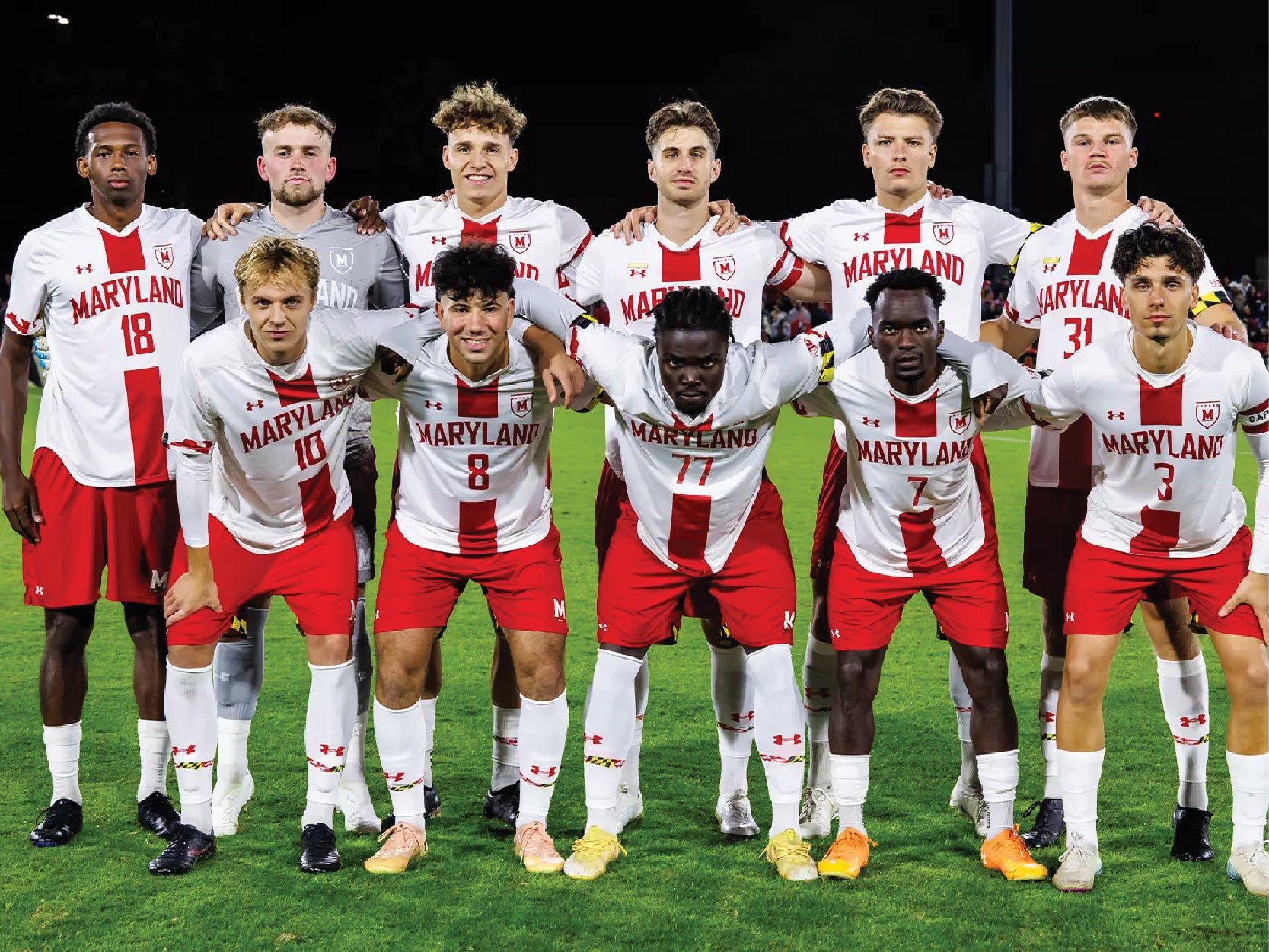 Members of the UMD men's soccer team pose in two rows