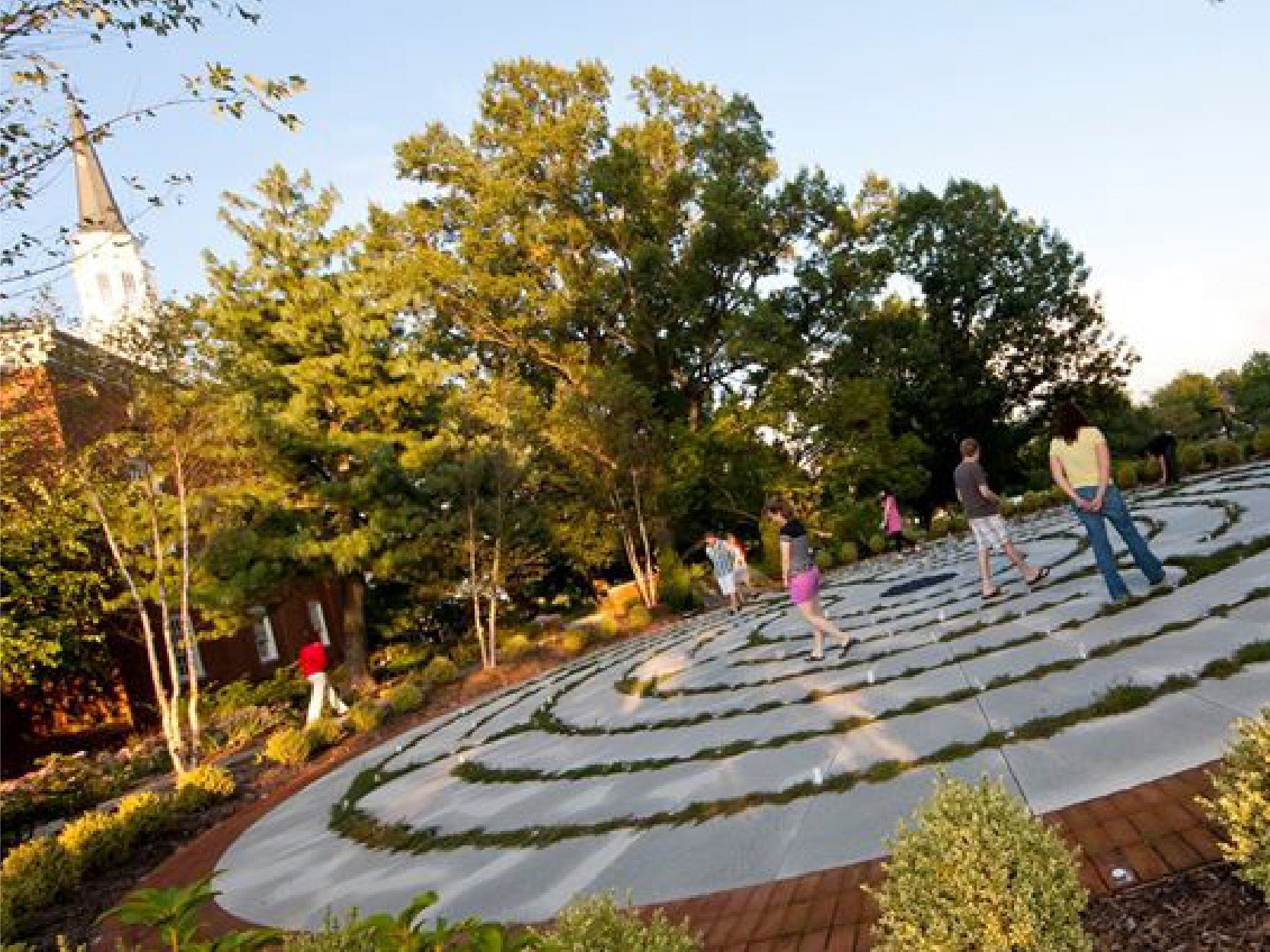 An image of students walking through the Chapel Garden