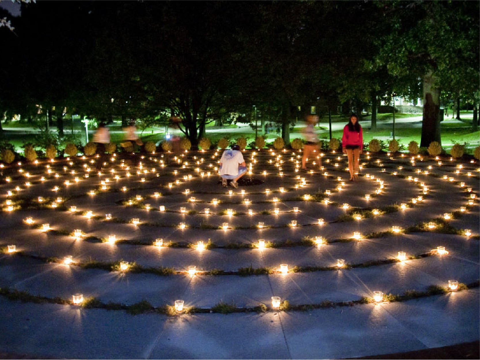 A photo of students waking at the Labyrinth at the Garden of Reflection and Remembrance
