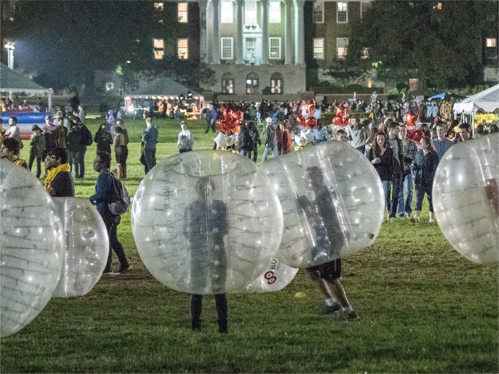 A photo of a nighttime bubble ball game.