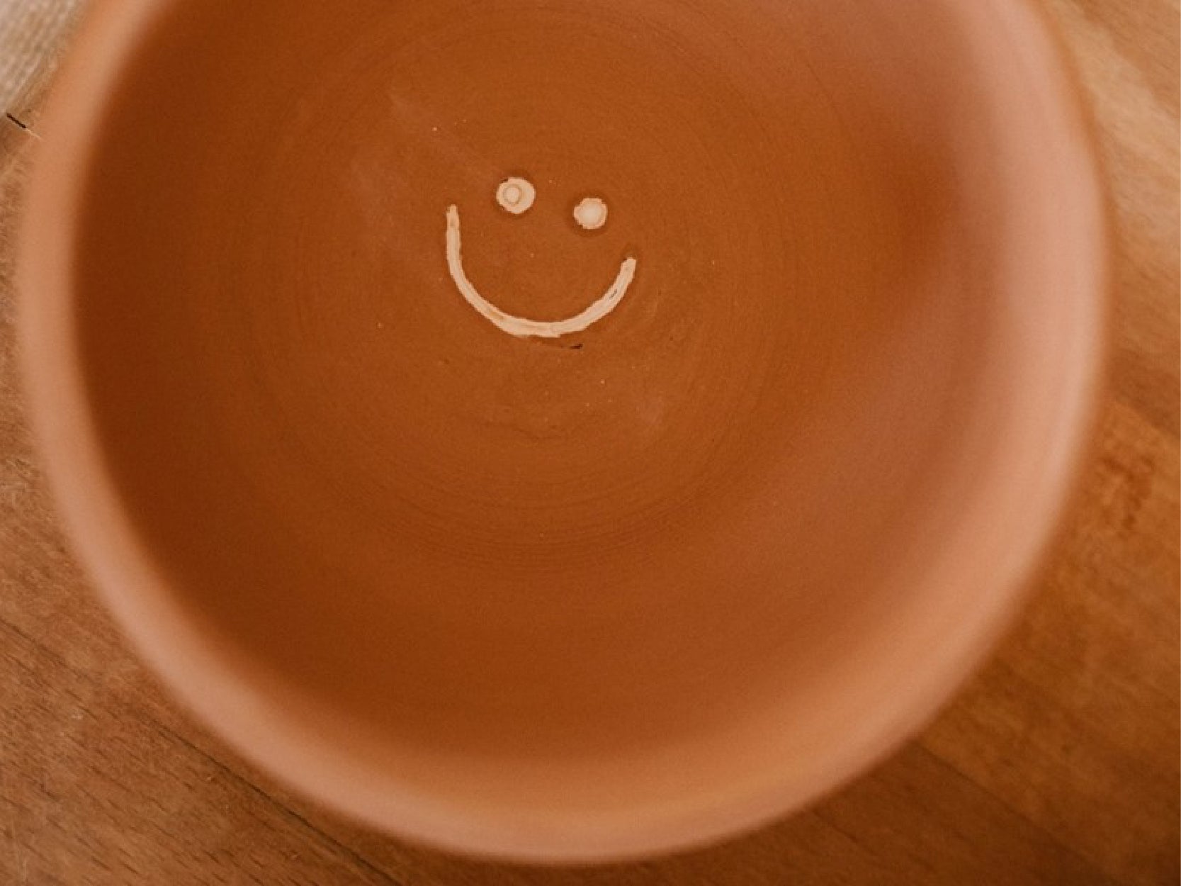 A photo of a ceramic smile bowl project made in Studio A.