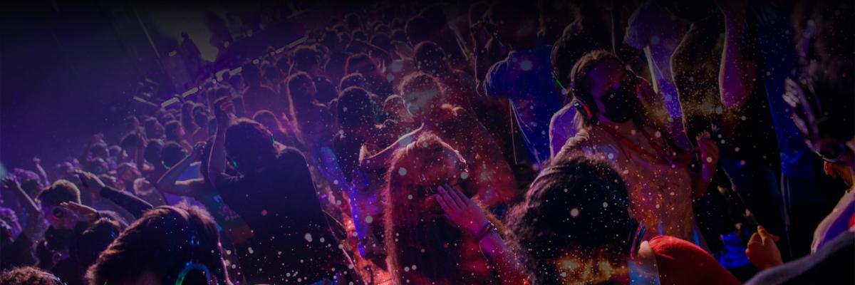 Image of students dancing at a silent disco, with a desaturated nebula pattern overlaid